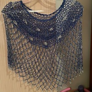 A stunning open weave cape embedded with sparkles